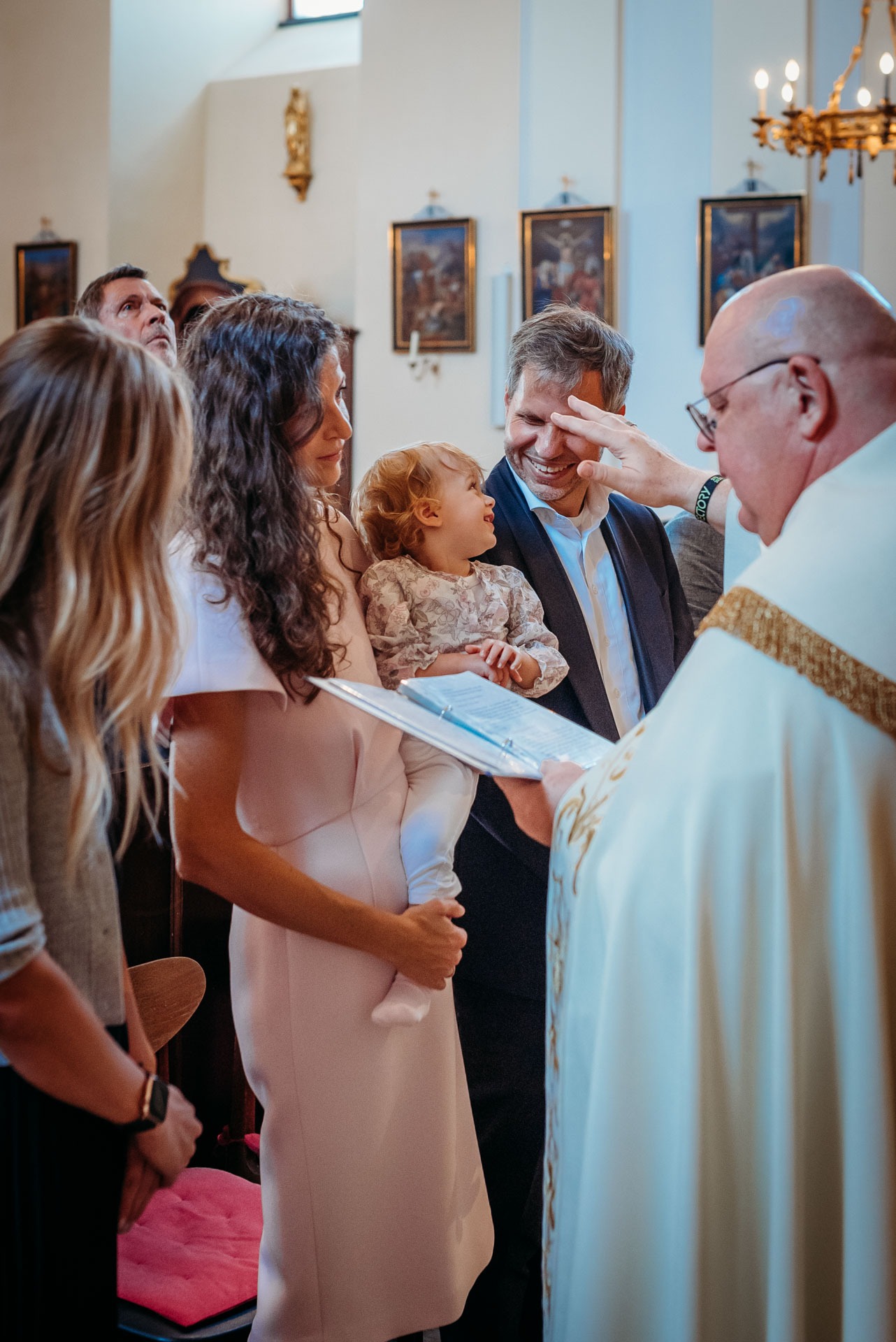 A little girl being baptized