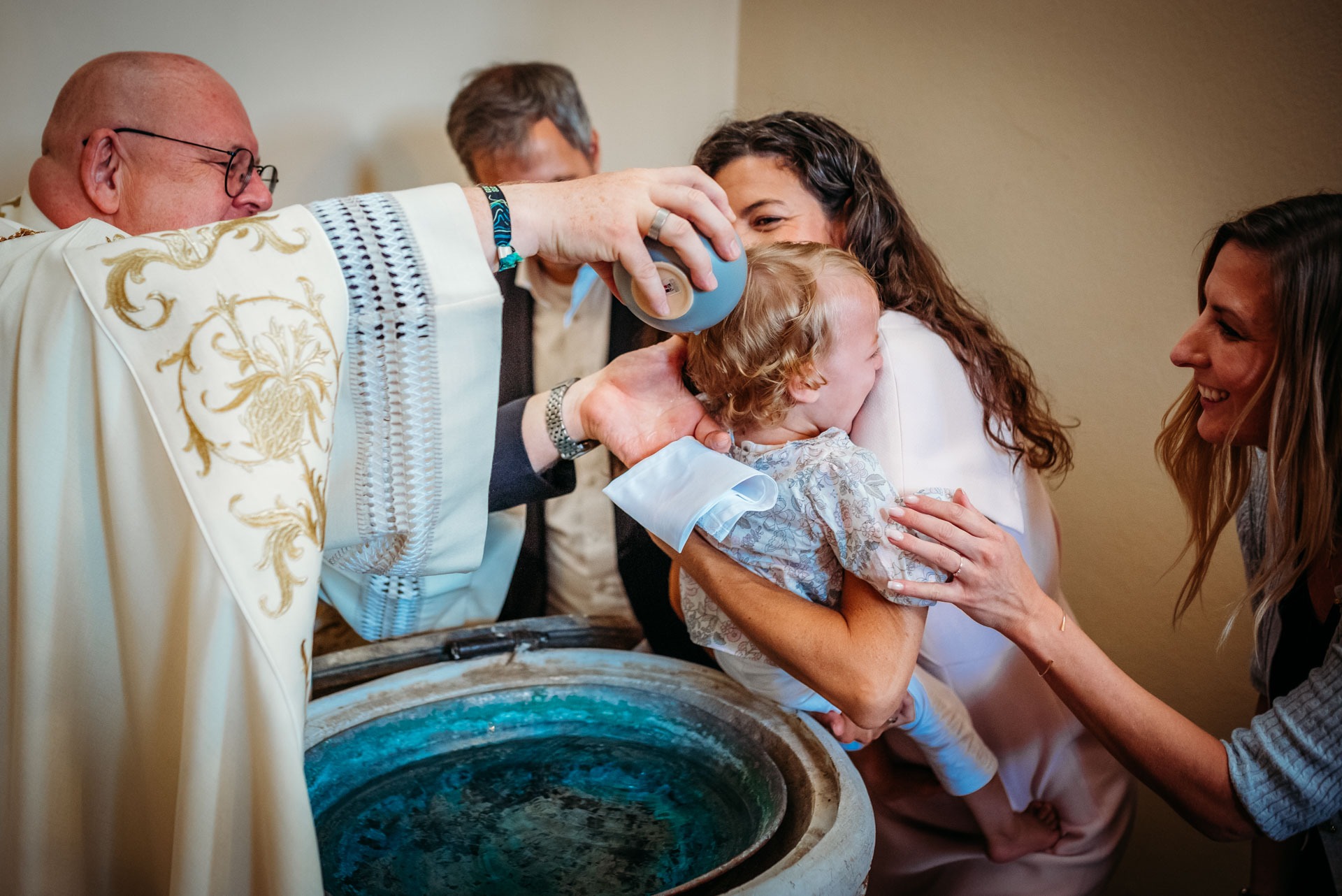 A little girl being baptized