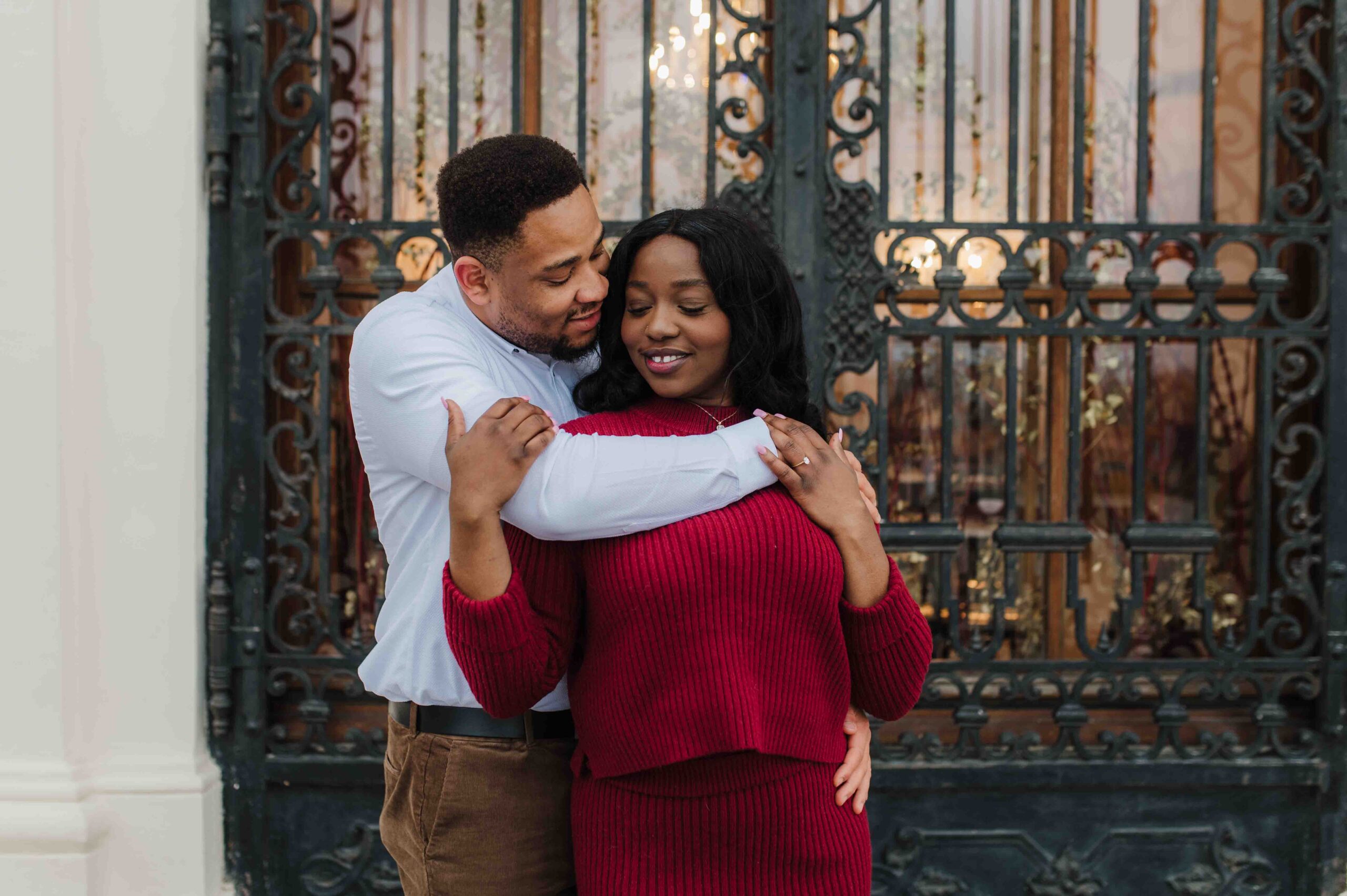 Couple embracing after a marriage proposal at Belvedere Palace in Vienna