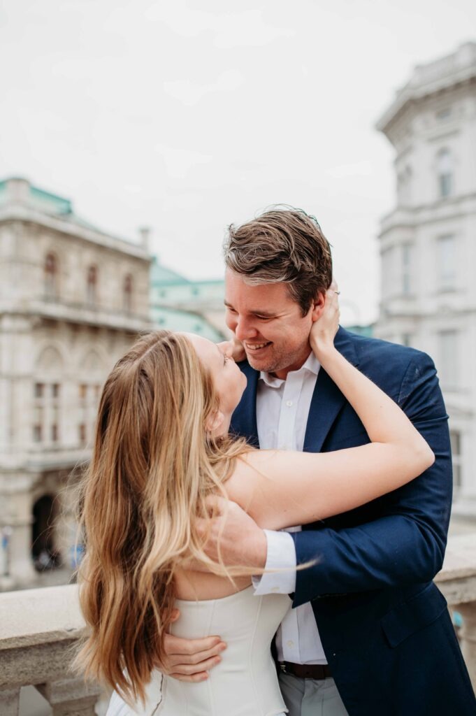 Romantic couple embracing during a proposal photo shoot in Vienna city center