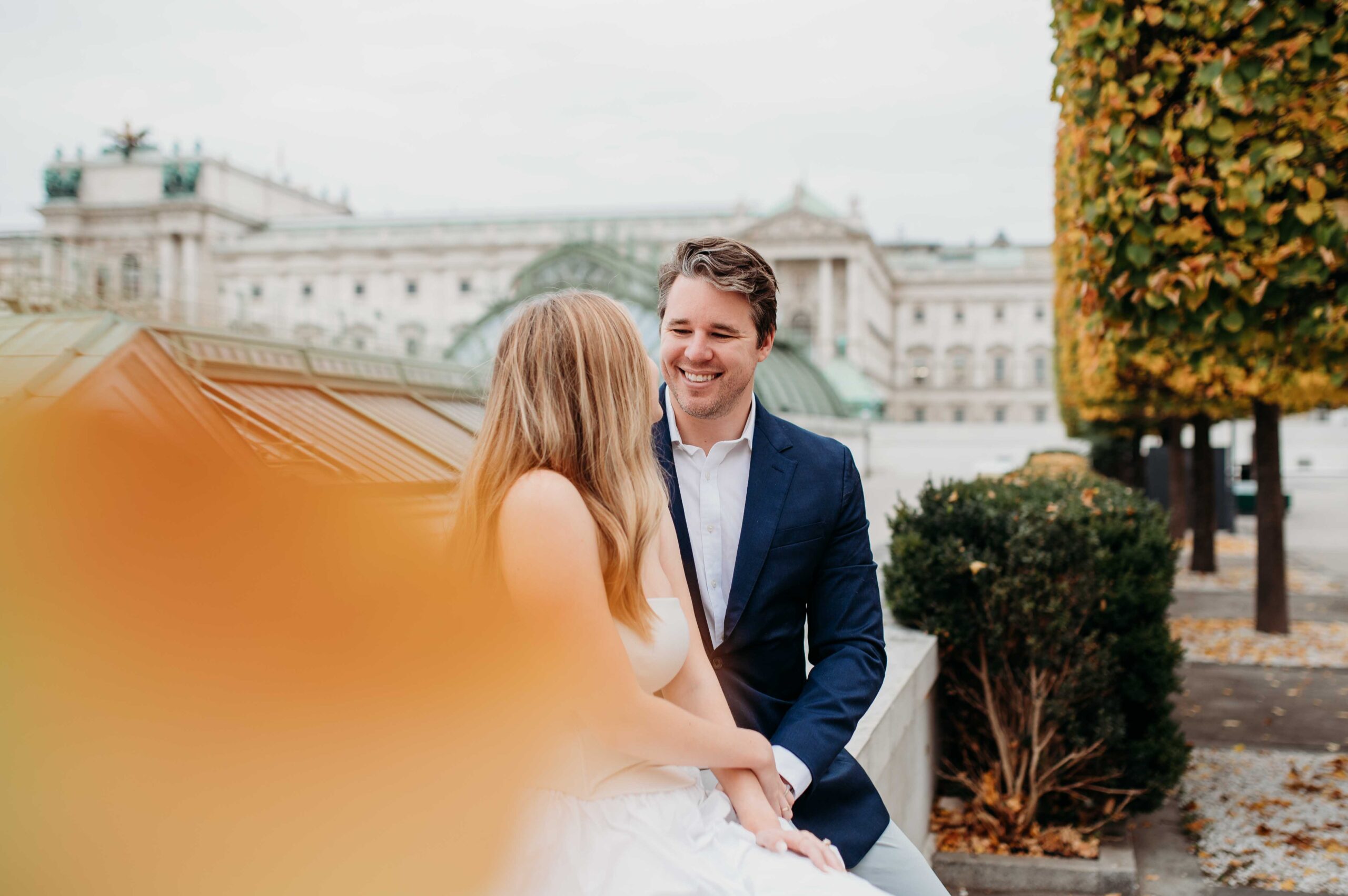 Joyful couple portrait with Vienna city center architecture in background